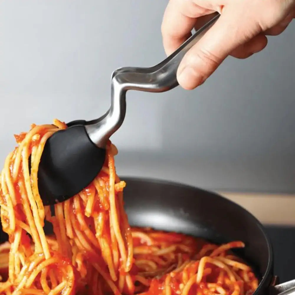 tongs lifting spaghetti from a pan with a gray background