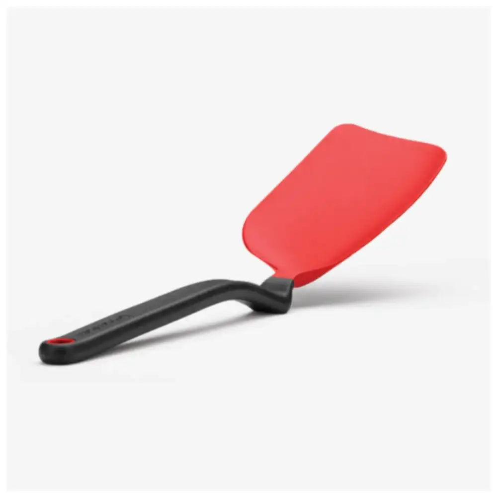 Red spatula with black handle on a white background