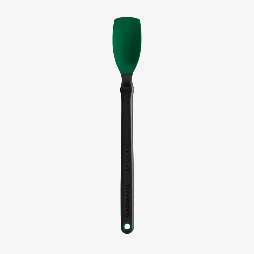 A silicone spatula with a dark green head and a black handle, shown vertically against a light gray background.