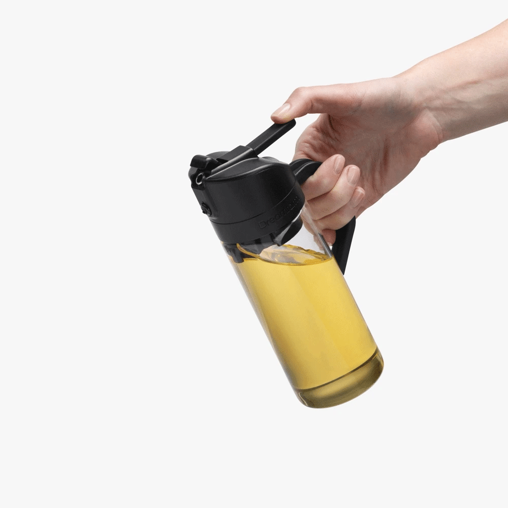 Hand holding a bottle with a white background