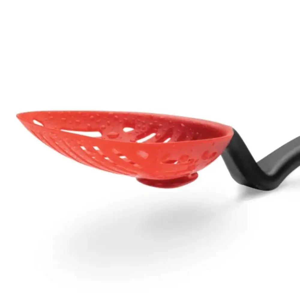 Red silicone strainer with black handle on a white background
