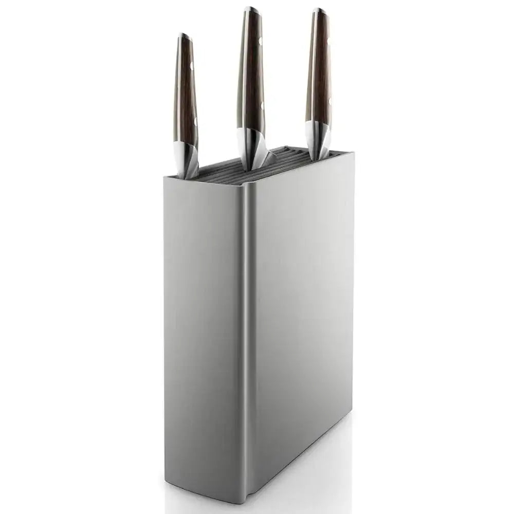 Stainless steel knife block with three knives on a white background