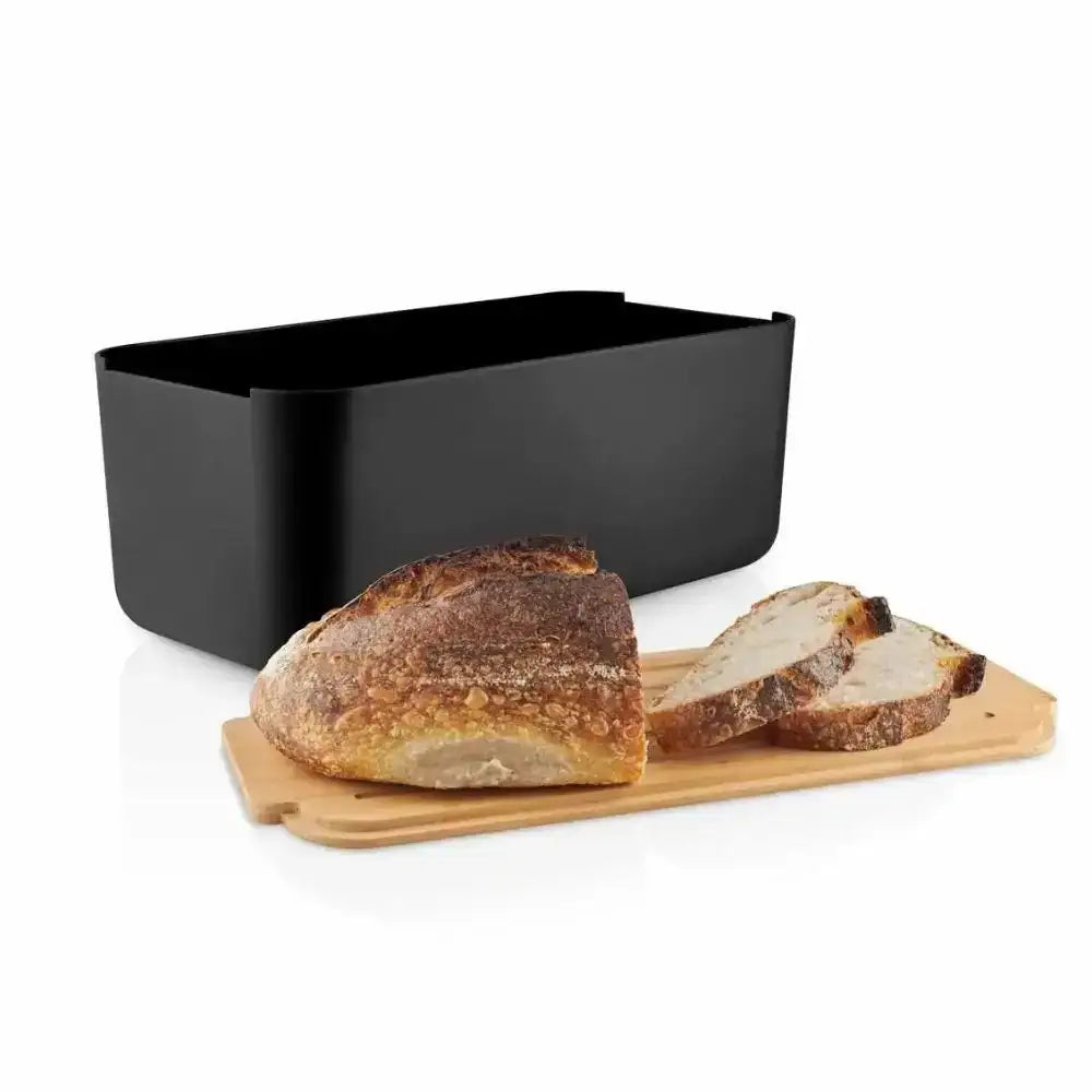 Black bread bin with sliced bread on a wooden board on a white background