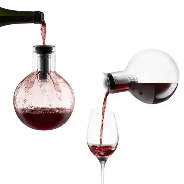 Eva Solo glass decanter carafe pouring red wine into glass, premium kitchenware at Cookin Stores