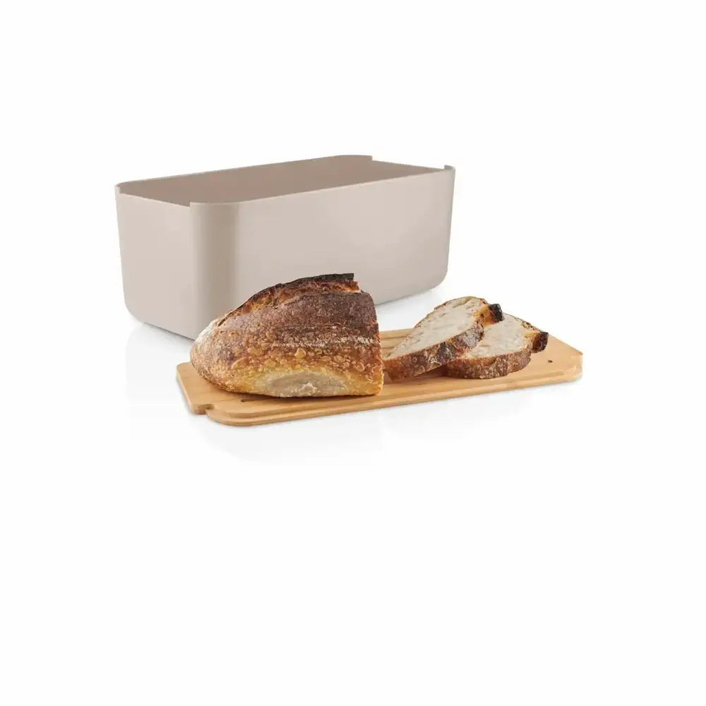 Beige bread bin with sliced bread on a wooden board on a white background