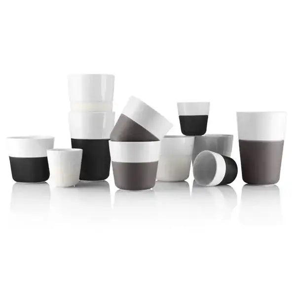 Assorted modern ceramic cups in black, white, and grey, displayed on a white background at Cookin Stores.