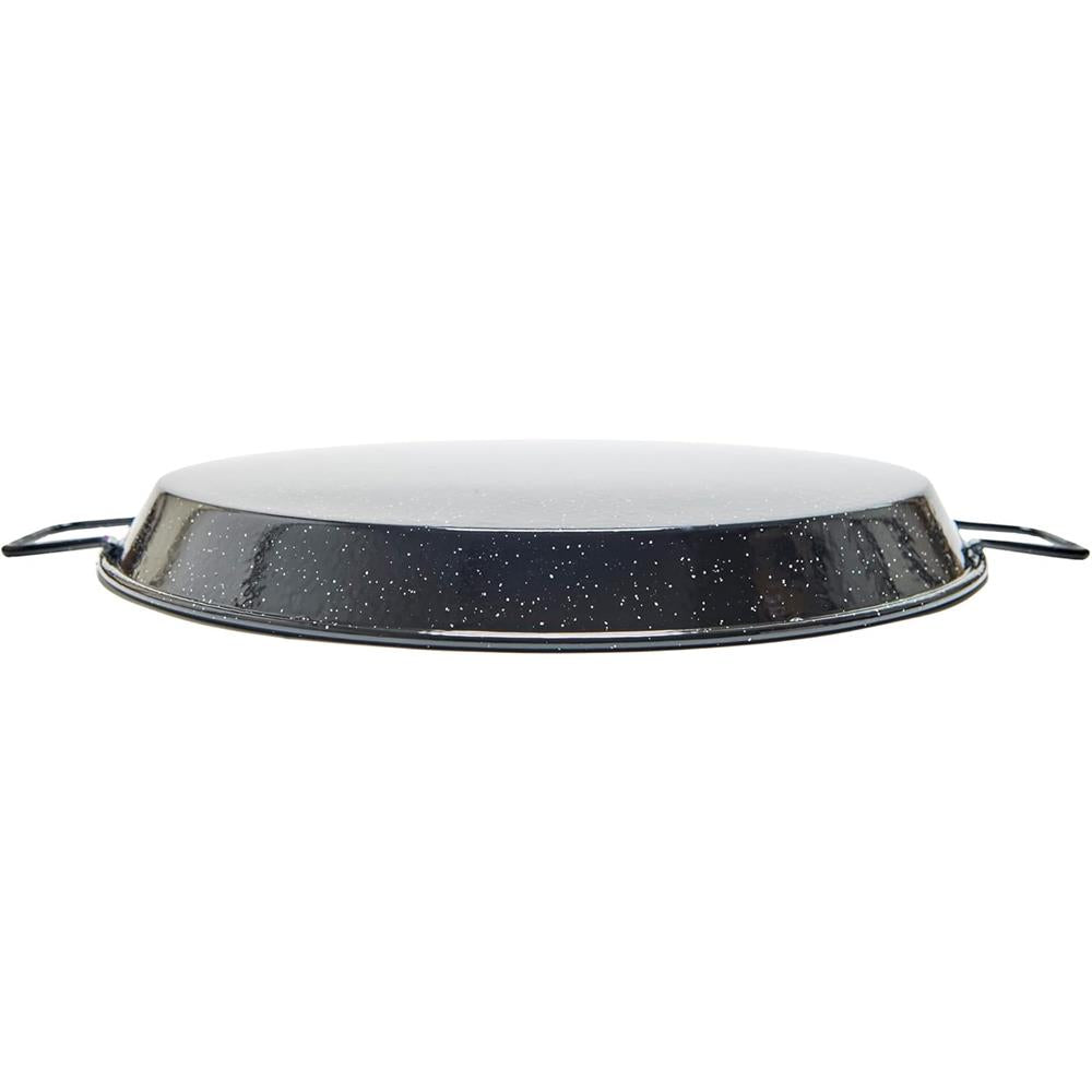 Round metal paella pan with speckled black and white design on a white background