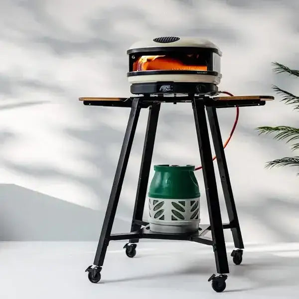 Gozney Arc XL pizza oven on stand with gas tank, modern kitchenware at Cookin Stores