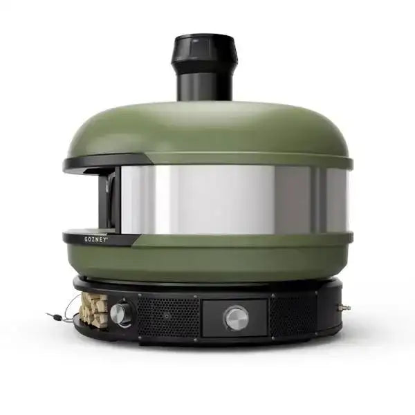 Gozney Dome multi-fuel outdoor pizza oven in green and black, premium kitchenware sold at Cookin Stores