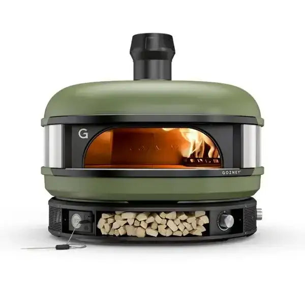 Gozney Dome multi-fuel outdoor pizza oven in green with wood storage, Cookin Stores kitchenware