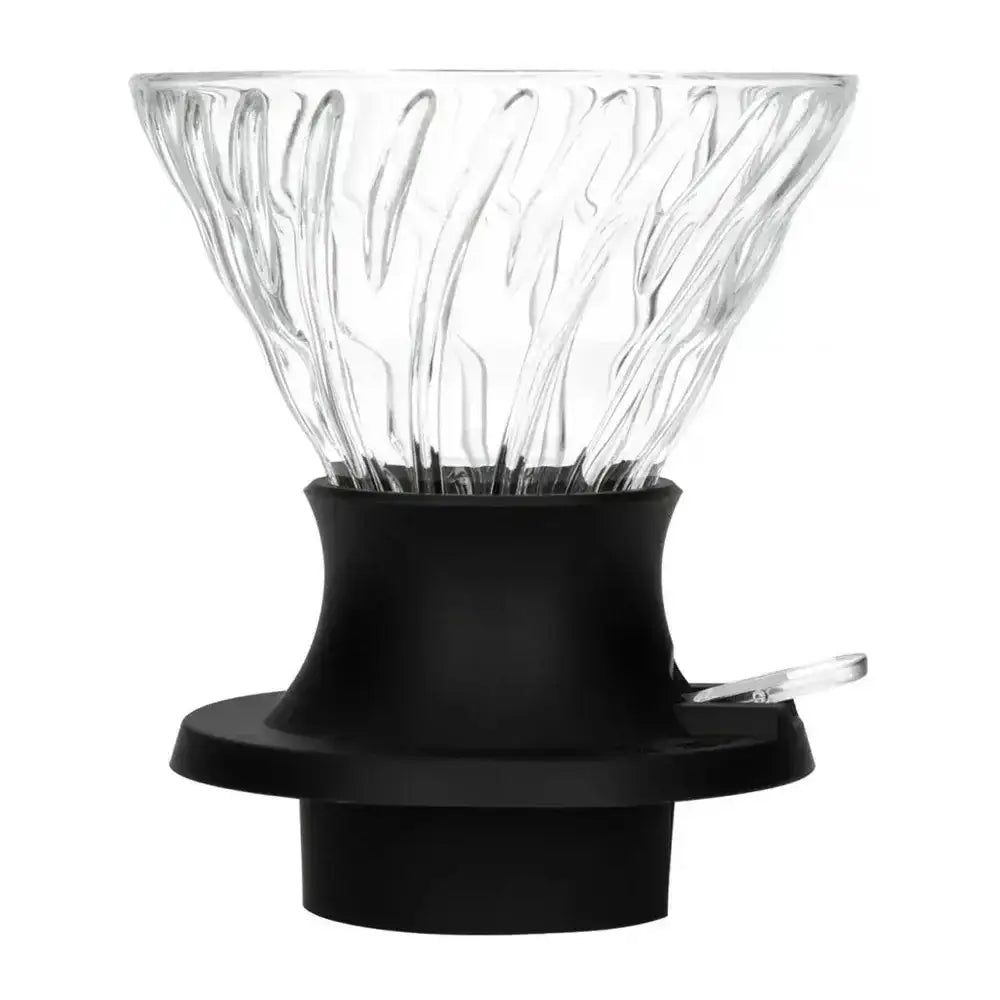 Clear glass coffee filter with black base on a white background