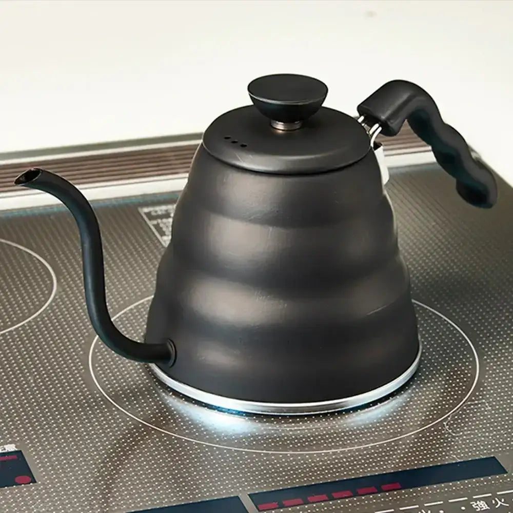 Black gooseneck kettle on a stovetop