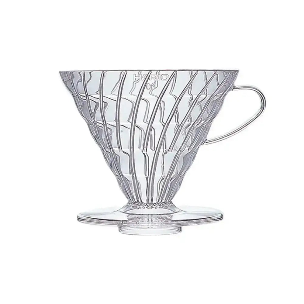 Clear glass coffee filter with decorative design on a white background