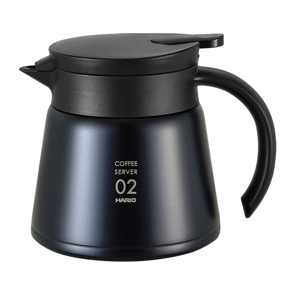 Black coffee server with handle on a white background