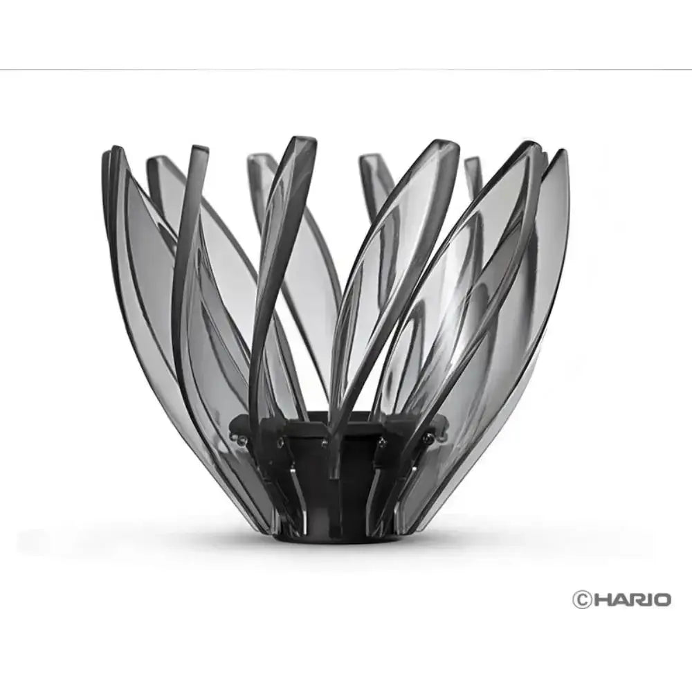 Black glass flower-shaped candle holder on a white background with 'HARIO' branding.