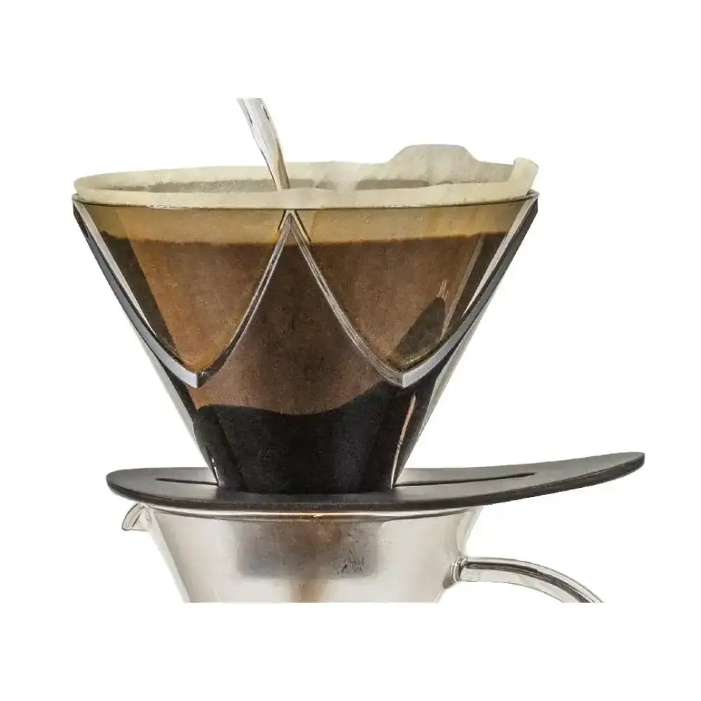 Coffee filter with coffee grounds on a white background