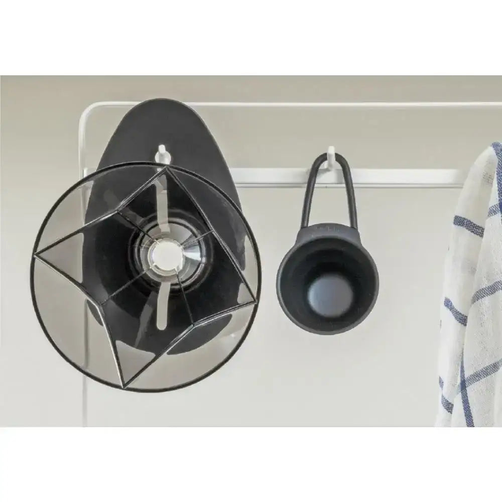 dripper filter e on a white wall