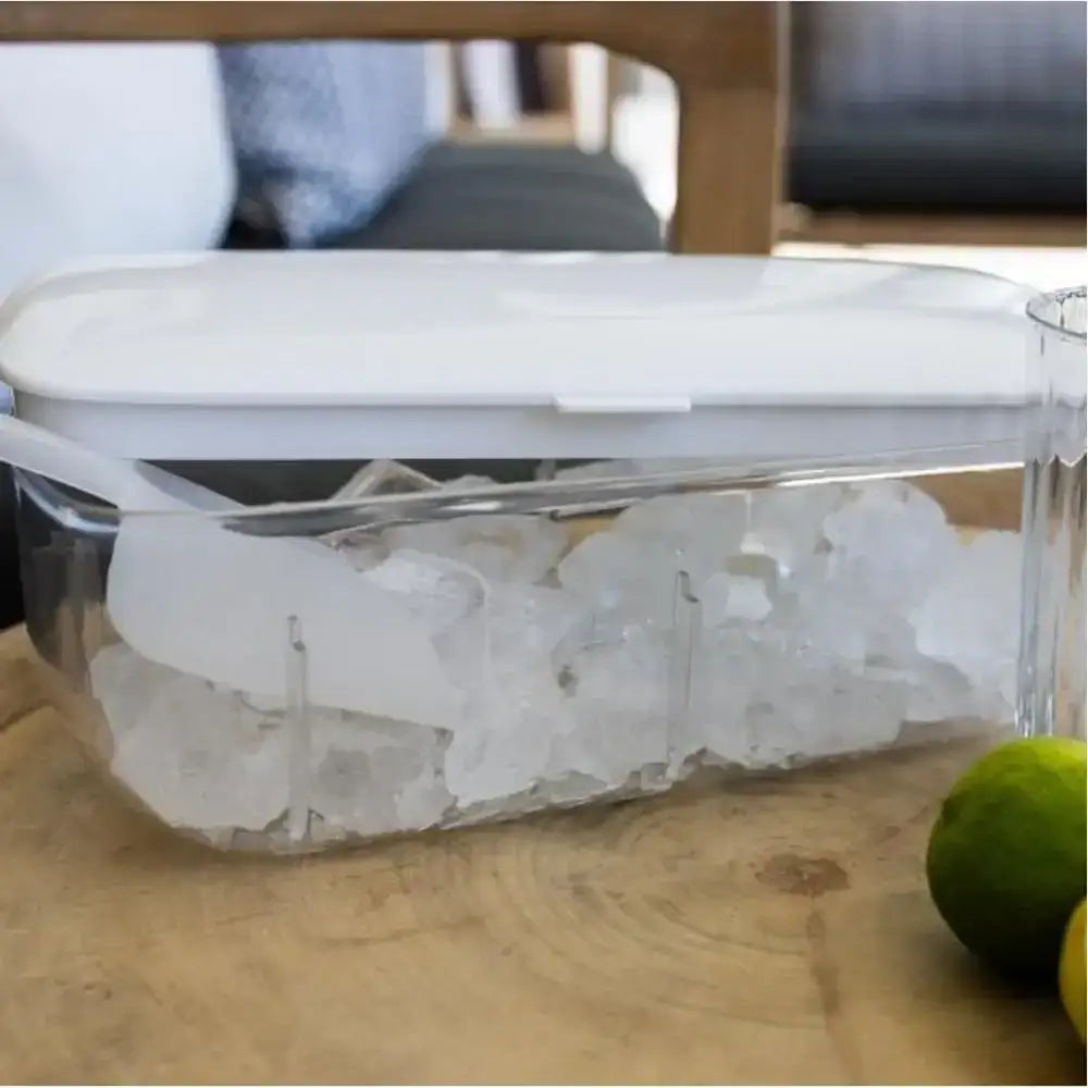 Clear container with ice cubes on a wooden surface