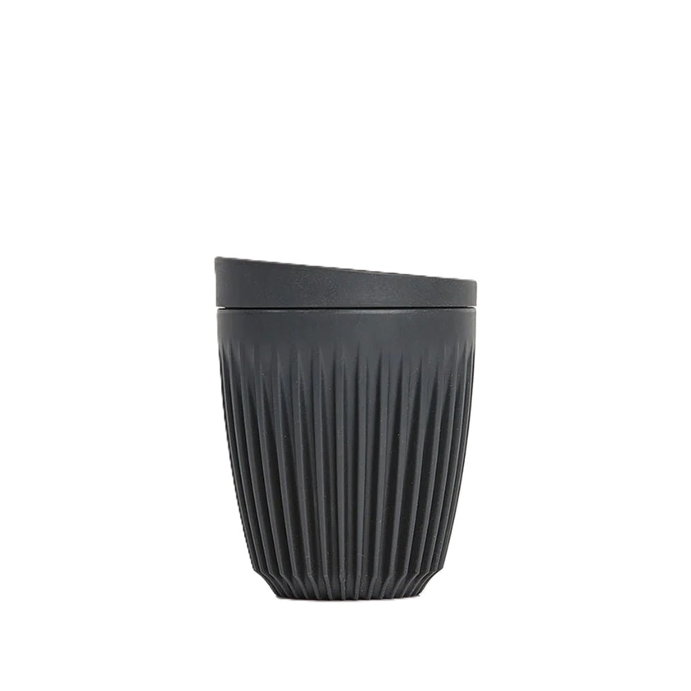 Black ribbed cup on a white background