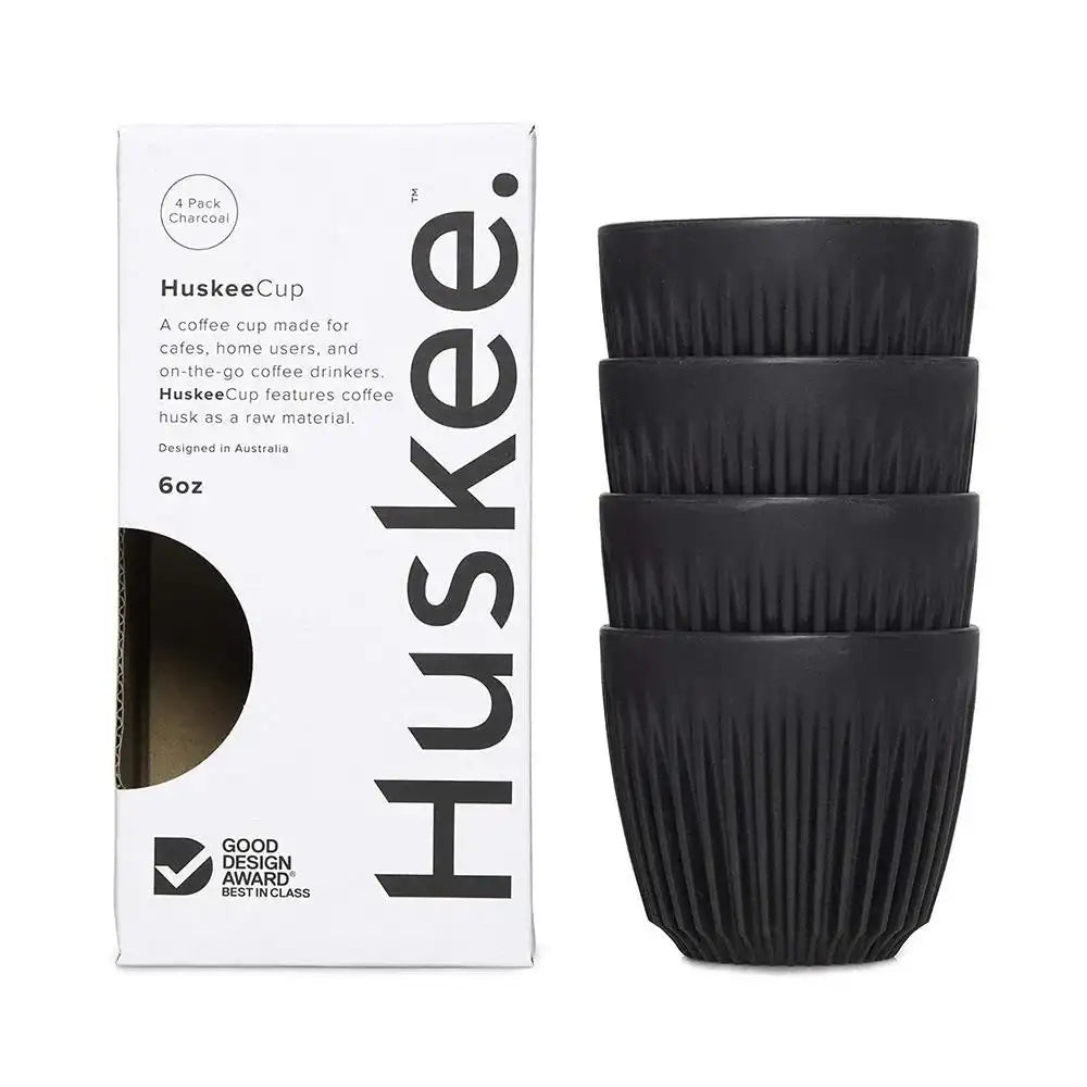 Black HuskeeCup coffee cups with packaging on a white background