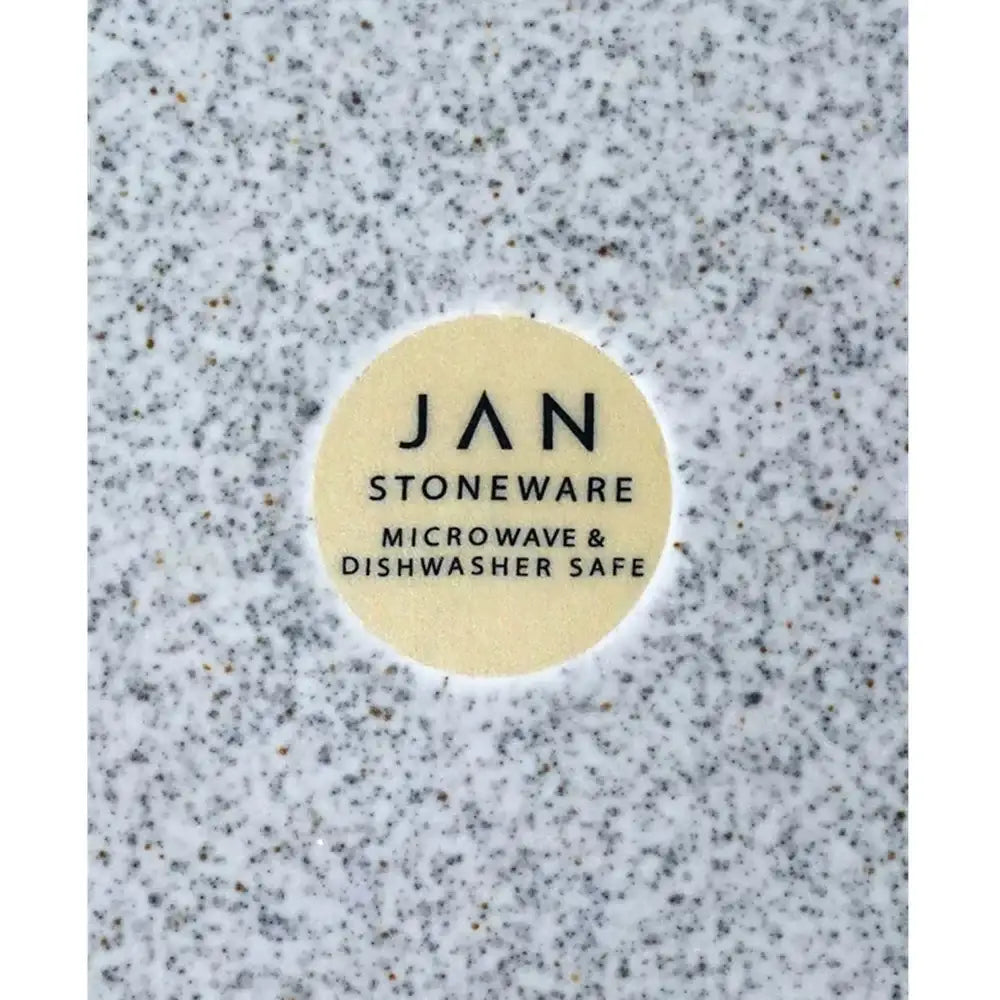Stoneware product with 'JAN Stoneware' label on a textured surface