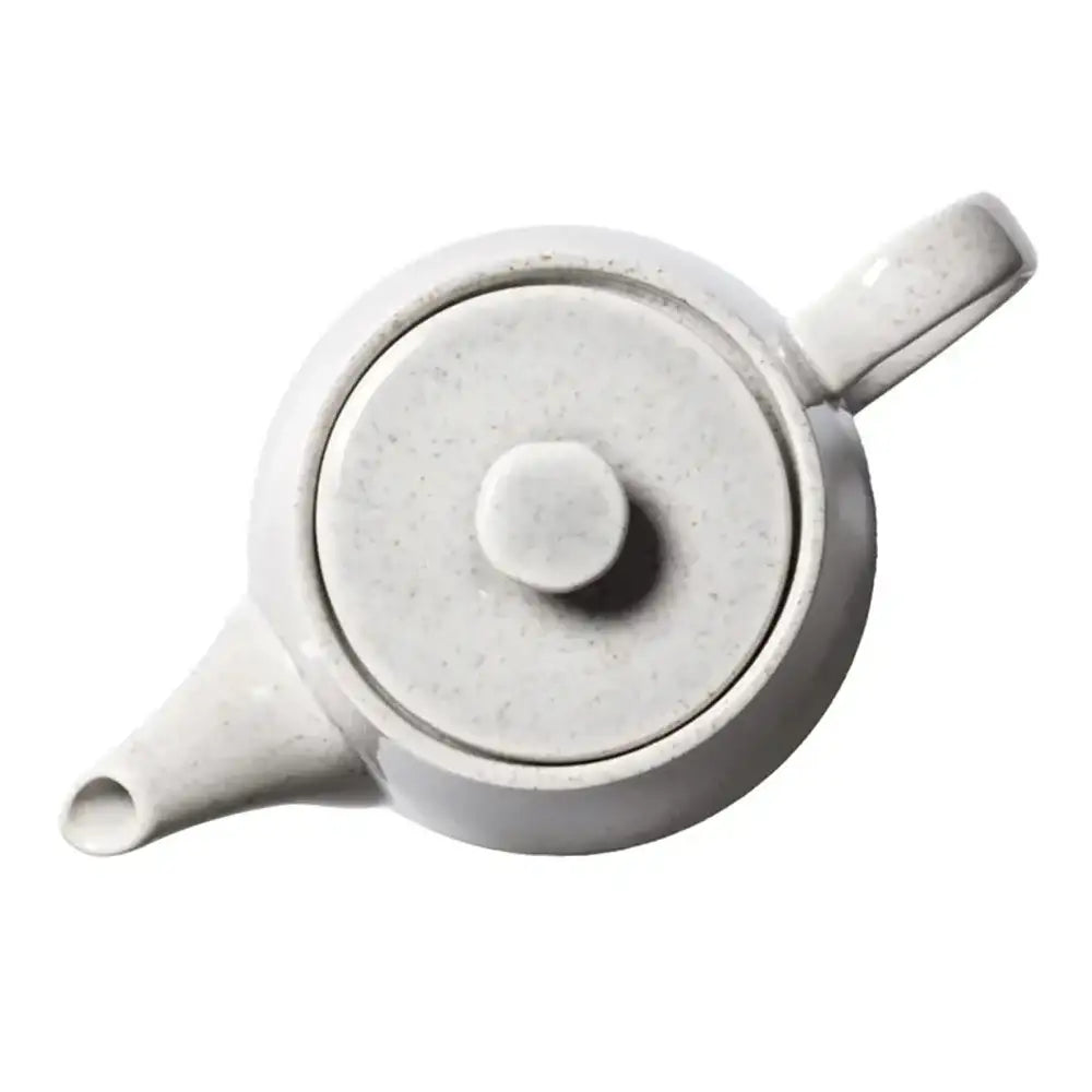 Grey ceramic teapot with lid on a white background