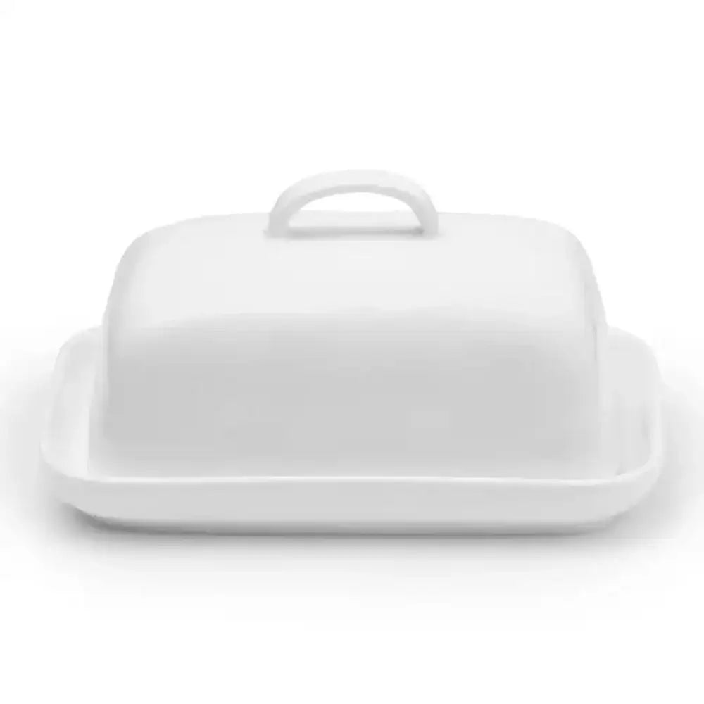 White ceramic butter dish with lid on a white background