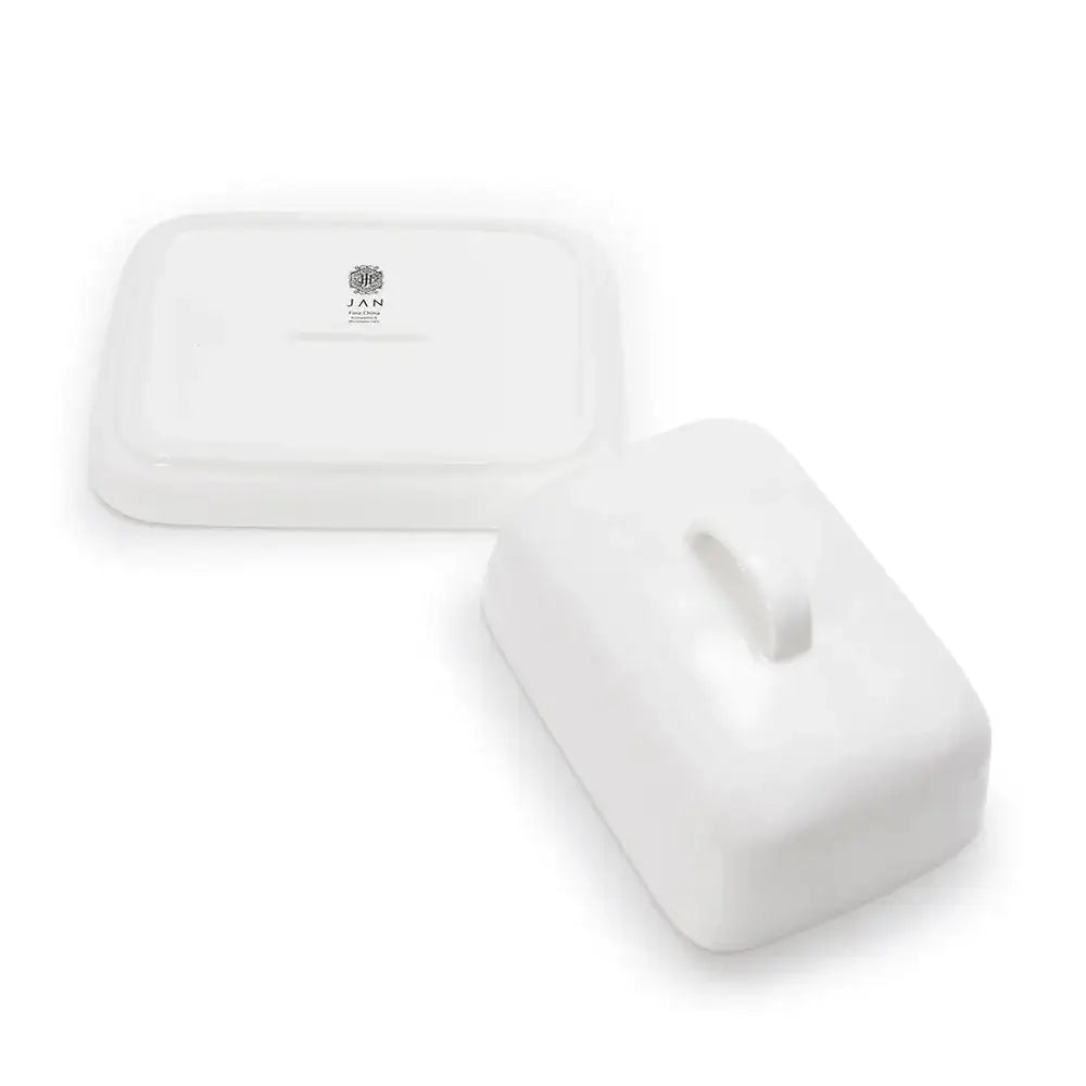 White ceramic bowls on a white background with 'JAN' branding.