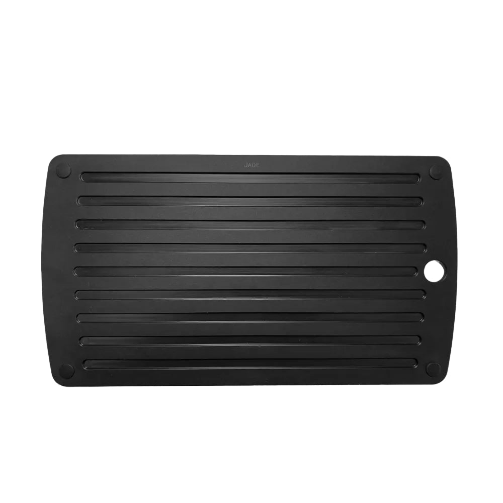 Black cutting board with a white background