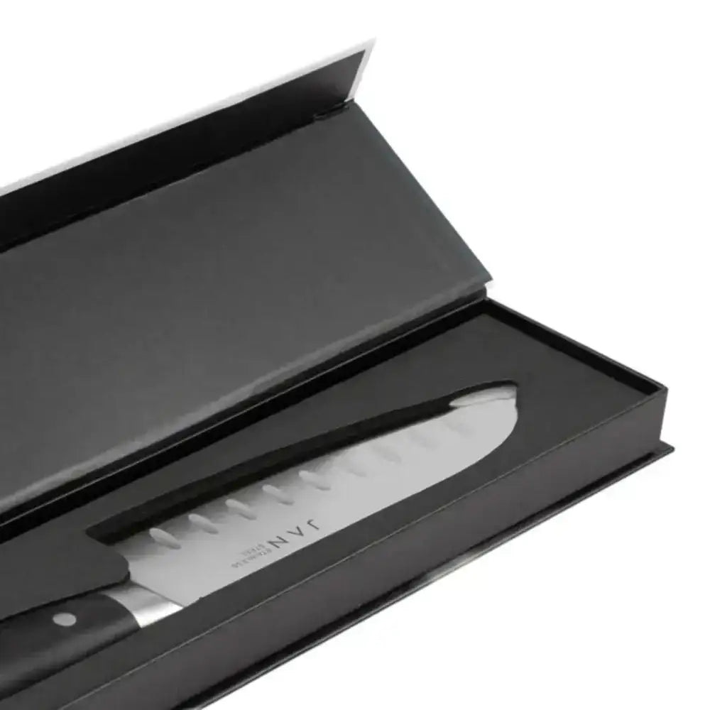 Knife in a black box with 'NVC' branding on a white background