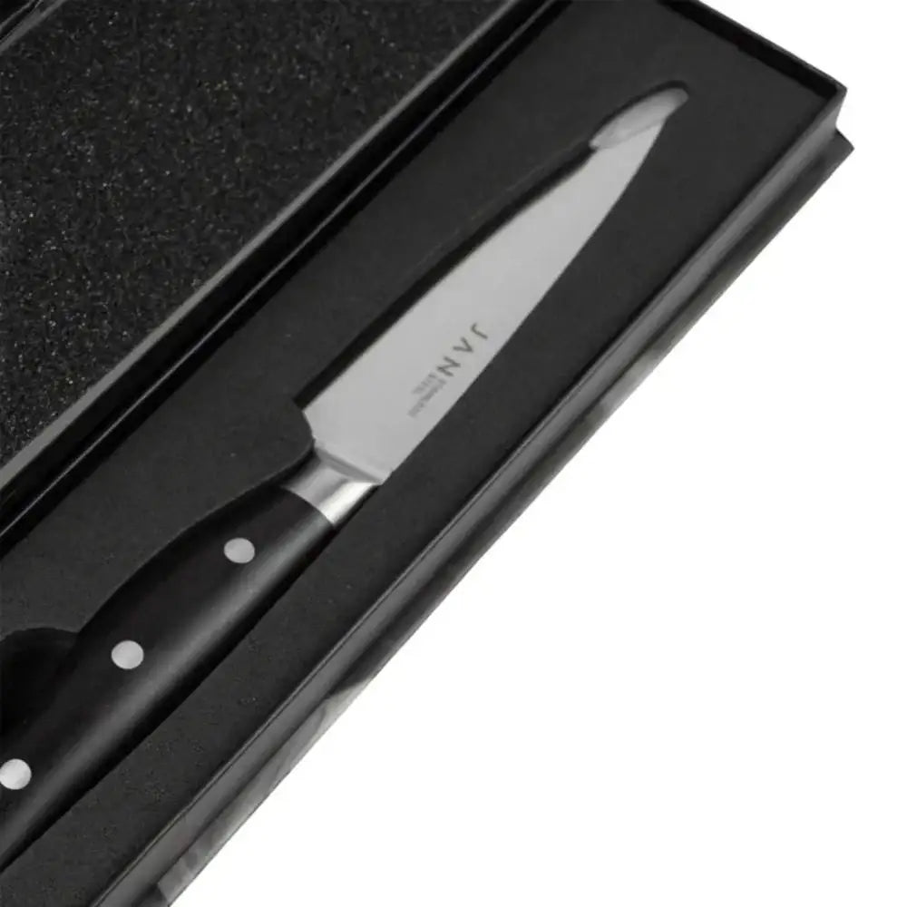 Knife set with a black handle and blade on a black textured surface