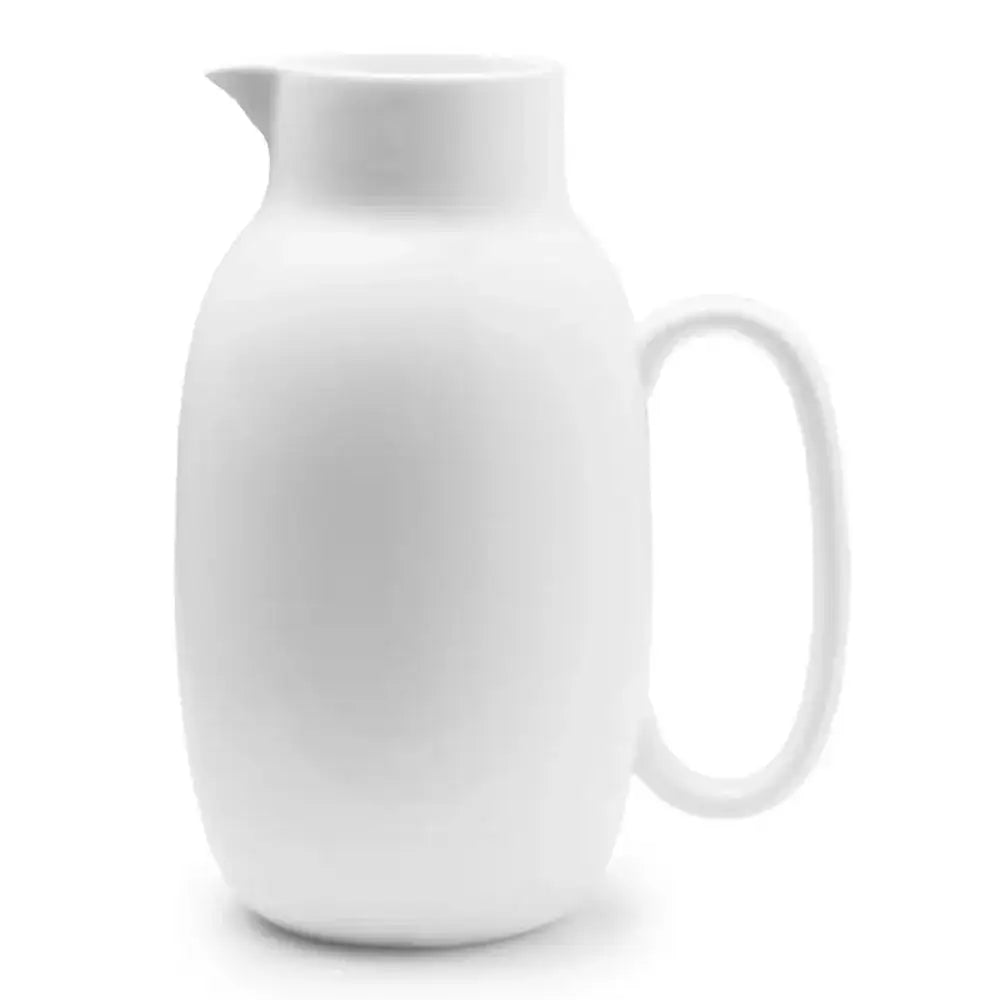 White ceramic pitcher on a white background