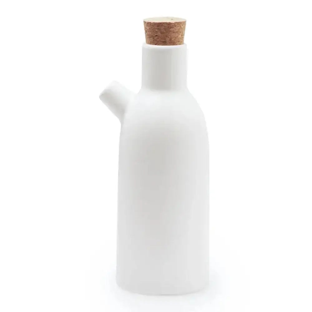 White ceramic oil bottle with a cork lid on a white background