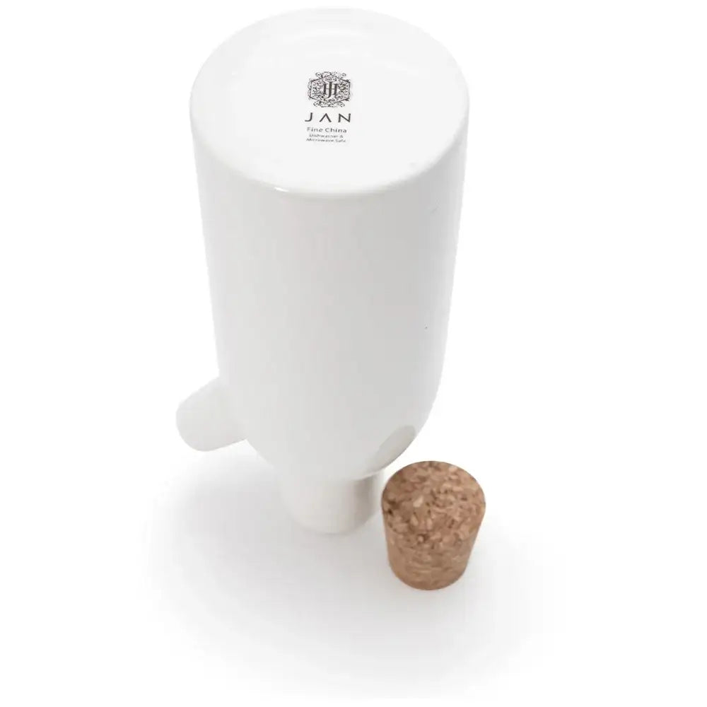 White ceramic container with a cork on a white background