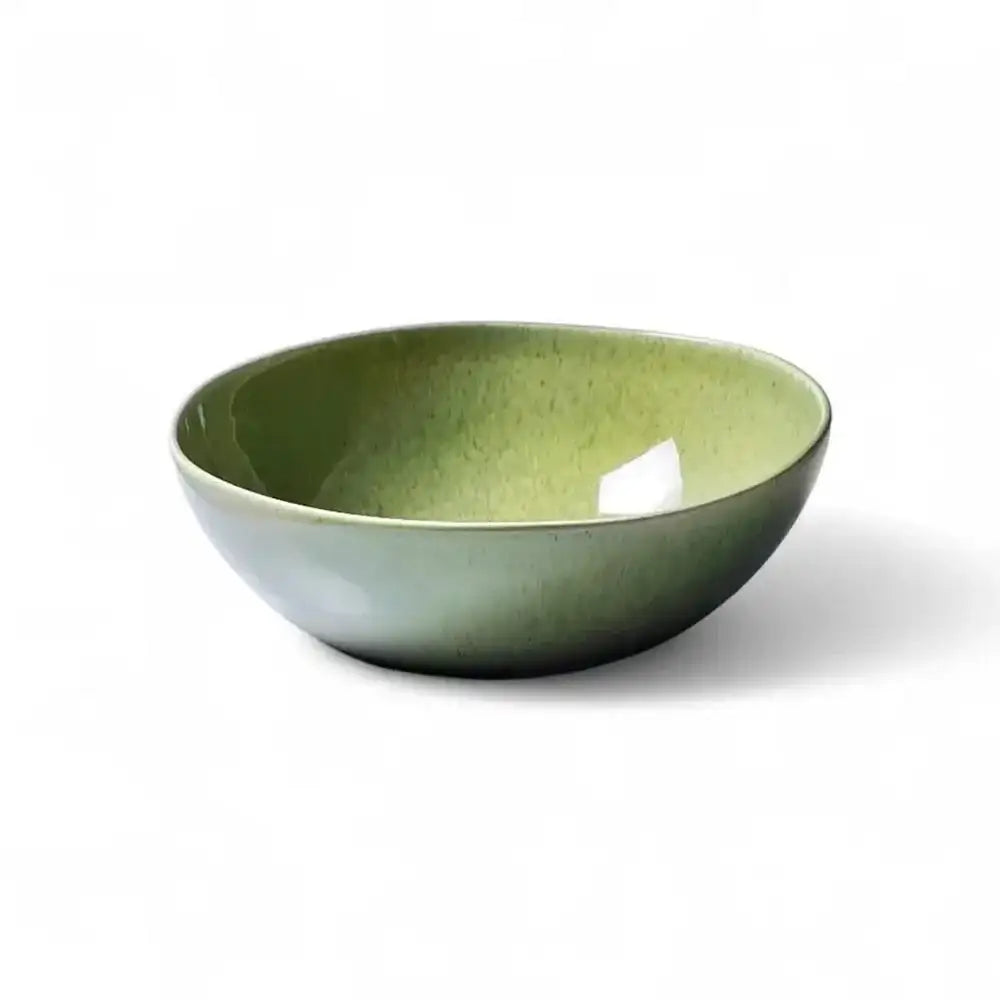 Green ceramic bowl on a white background