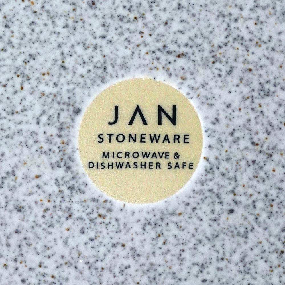 Round label with 'JAN Stoneware' text on a speckled gray background