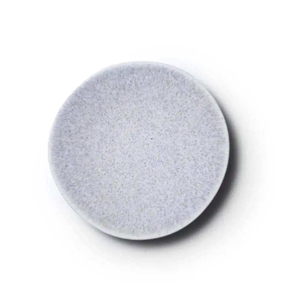 Round gray stone coaster on a white background