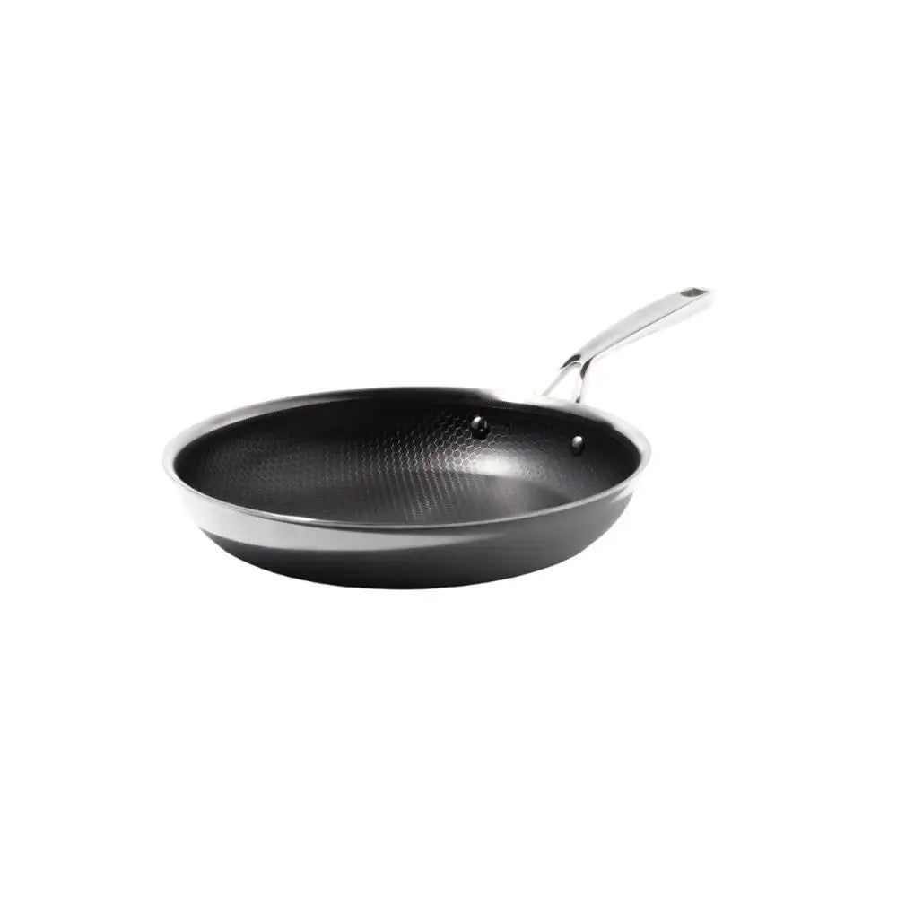 Black frying pan with a silver handle on a white background