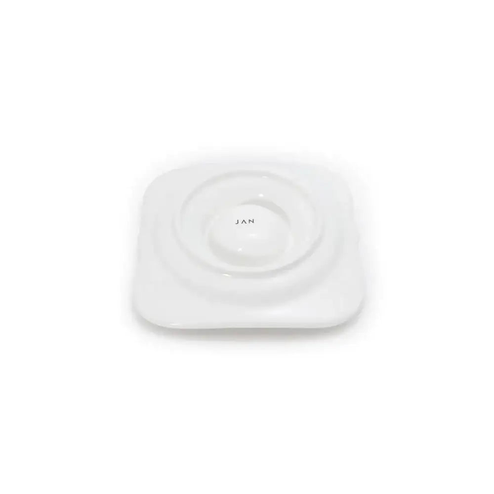 White egg holder bottom with 'JAN' branding on a white background