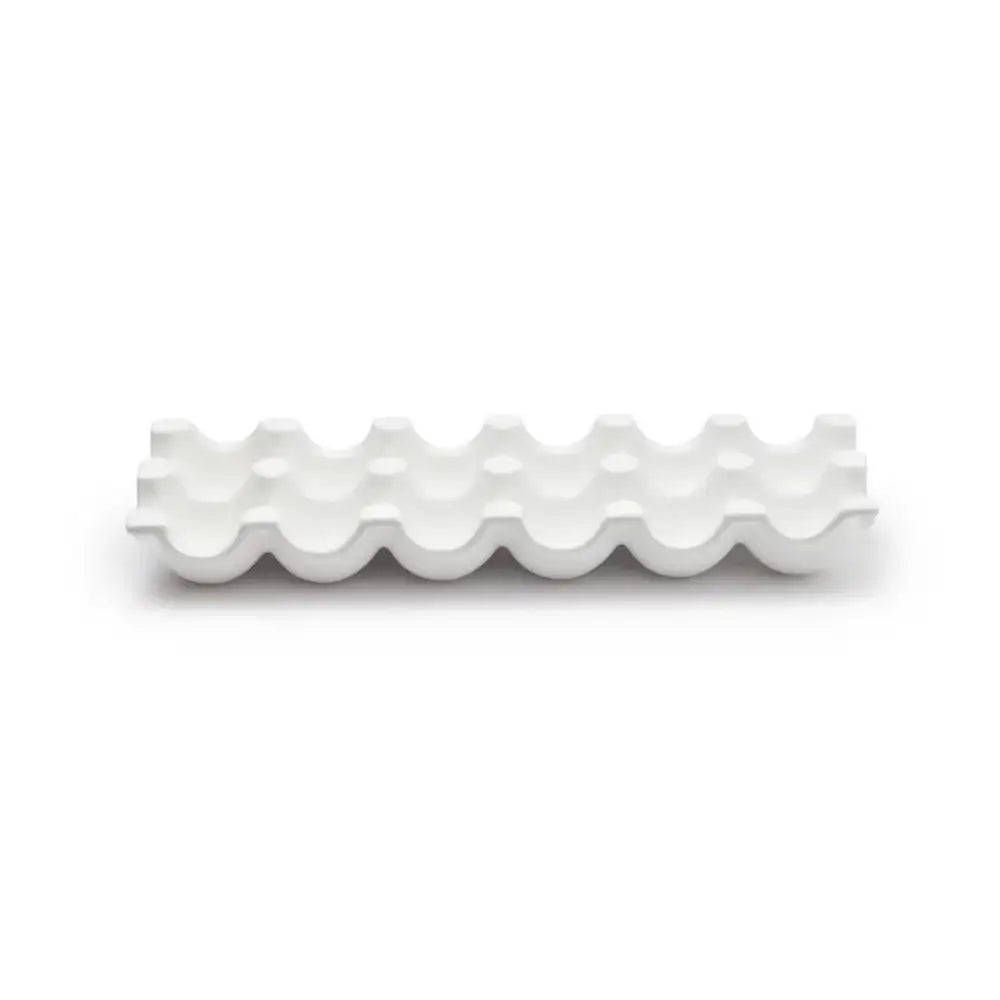 White wavy ceramic plate on a white background