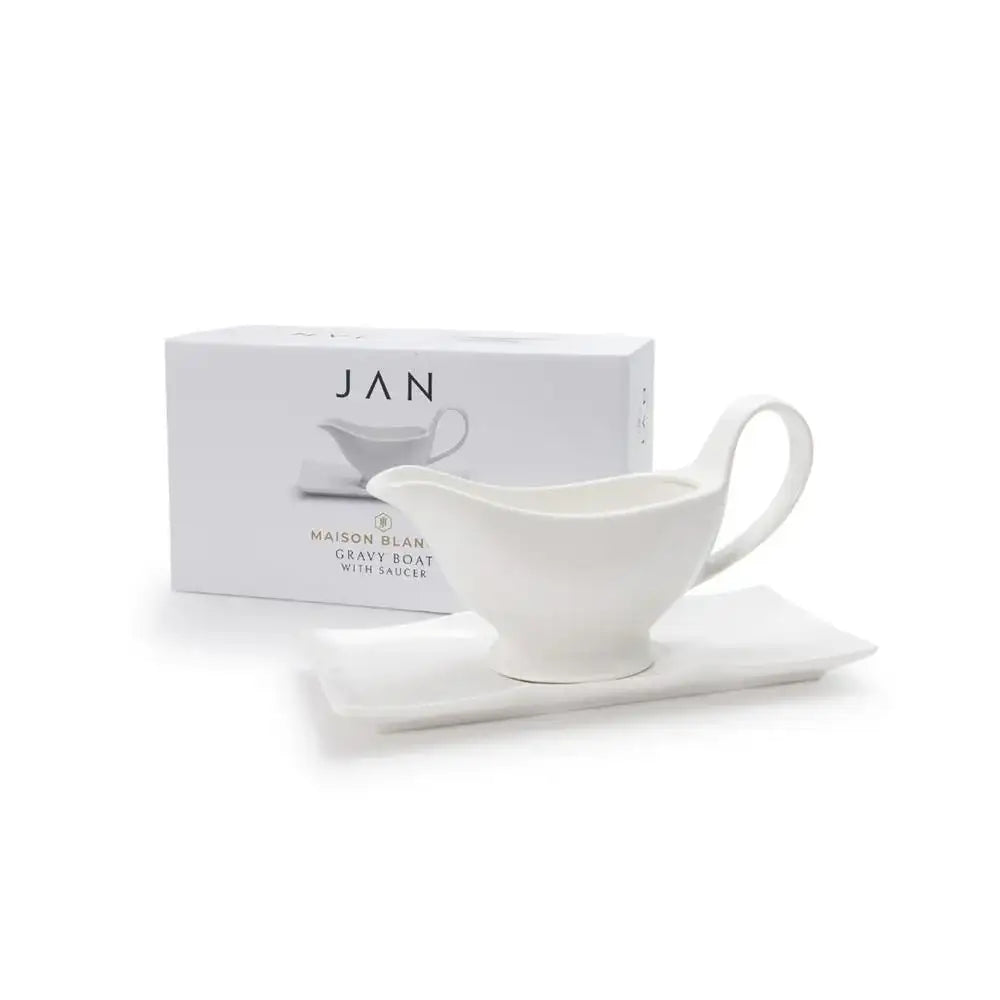 White gravy boat with ladle on a white surface, featuring the brand 'JAN'.