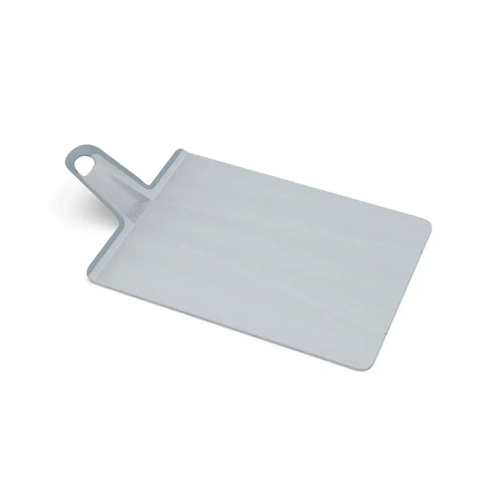 Gray plastic cutting board with a handle on a white background