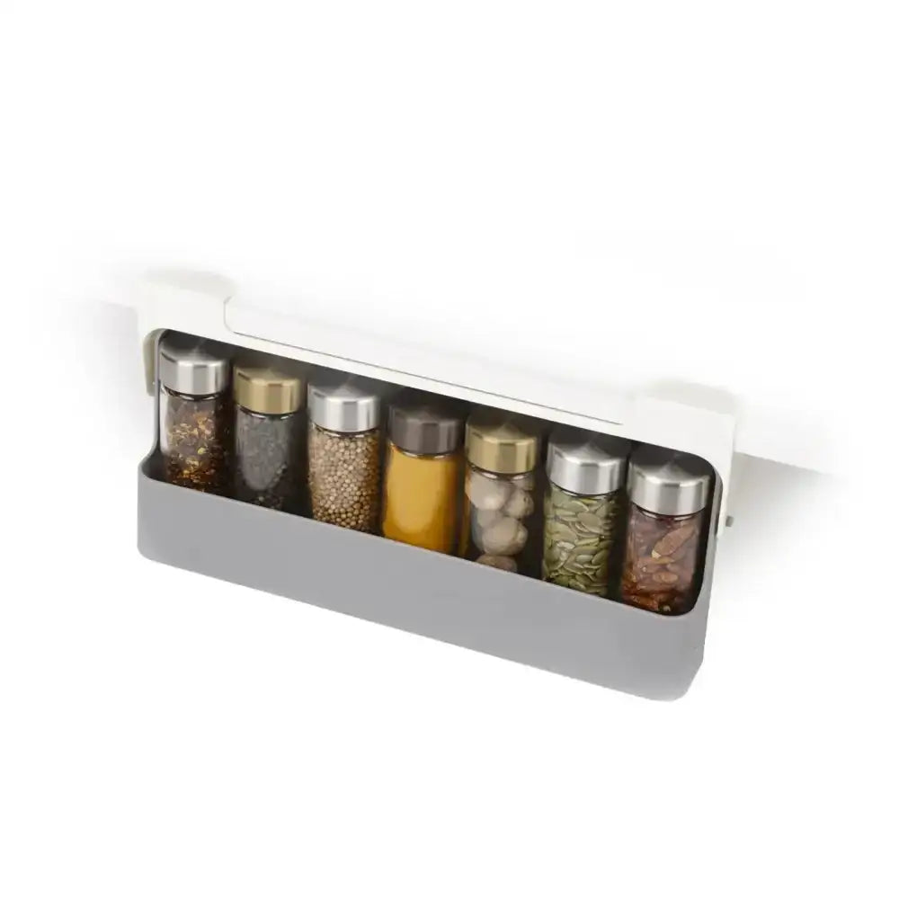 Spice rack with various spice containers on a white background