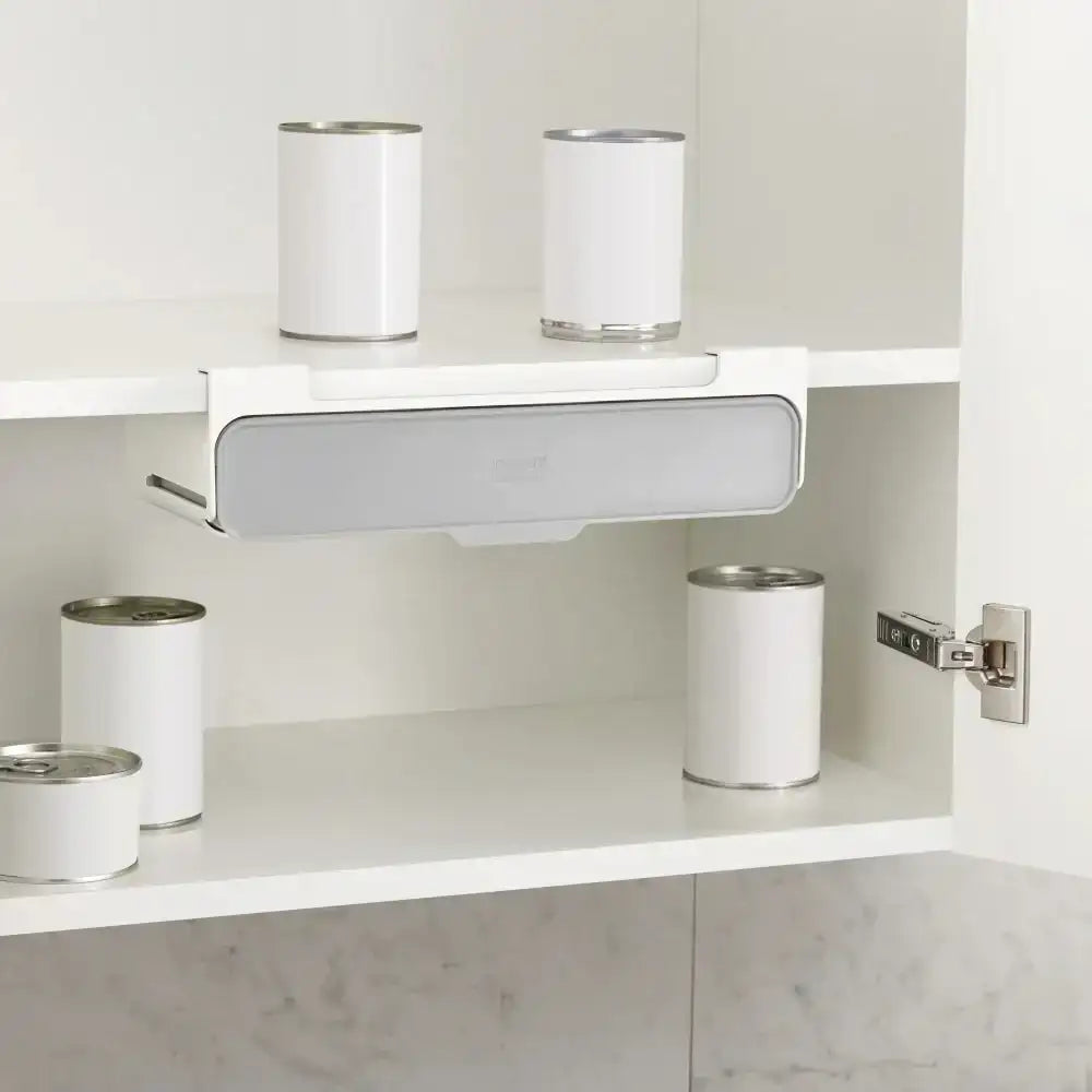 White shelves with cans inside a cabinet