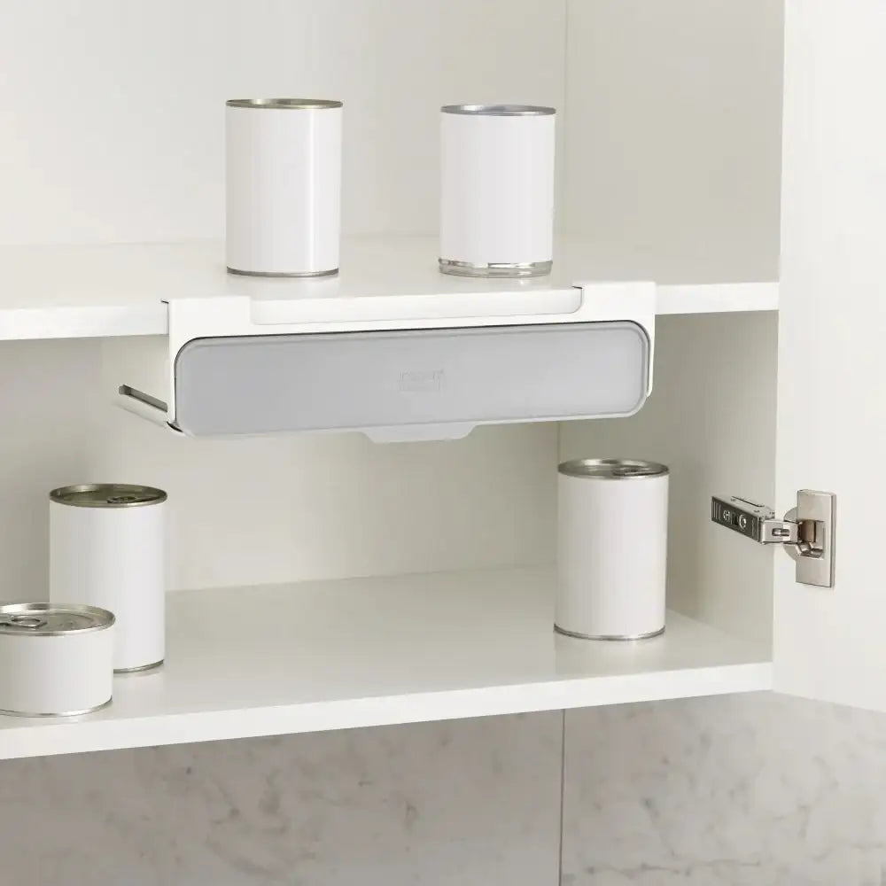 White shelves with cans inside a cabinet