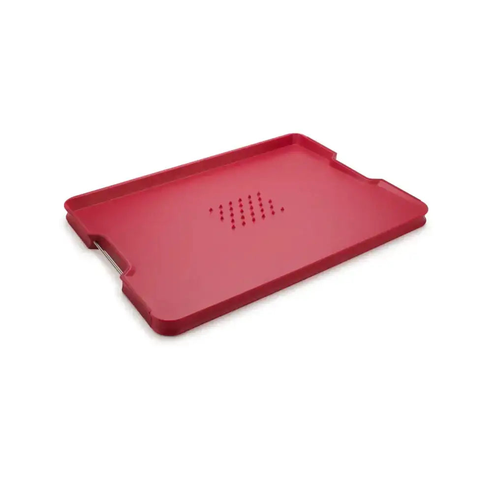 Red plastic tray with ventilation holes on a white background