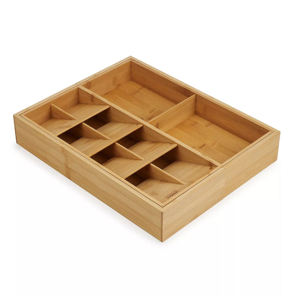 A rectangular bamboo organizer tray with multiple compartments, shown at an angle on a white background.