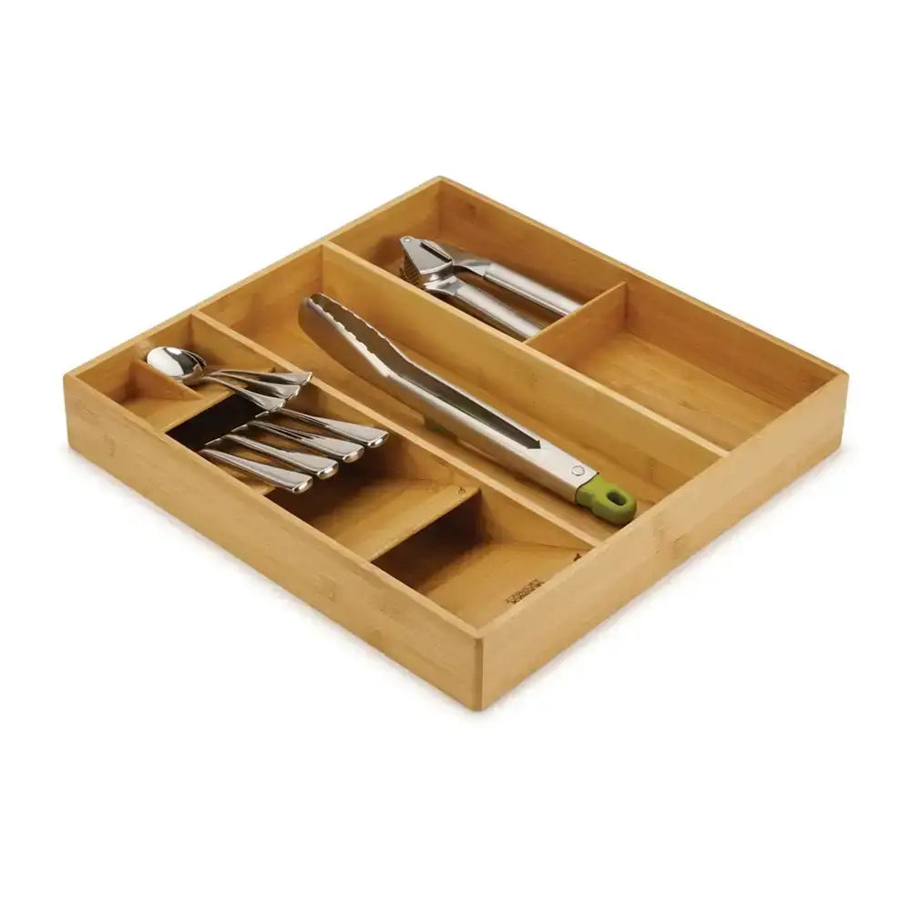 Wooden kitchen utensil organizer with silverware on a white background