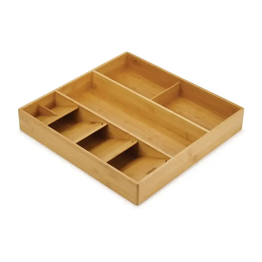 Wooden drawer organizer with compartments on a white background