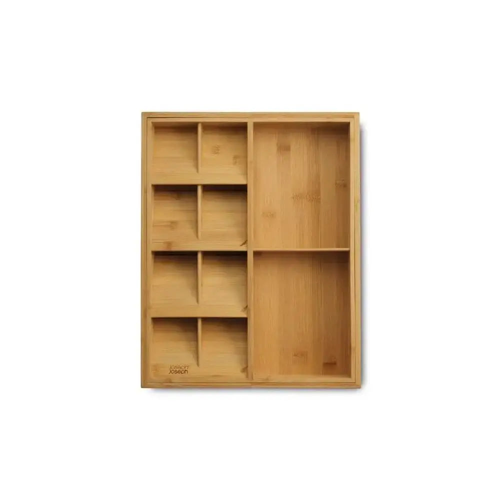 Wooden drawer organizer with multiple compartments on a white background